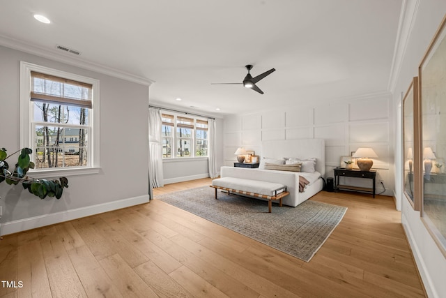 2105 Gardenbrook Dr, Raleigh, NC 27606 - bedroom featuring crown molding, hardwood / wood-style floors, recessed lighting, ceiling fan, and a decorative wall