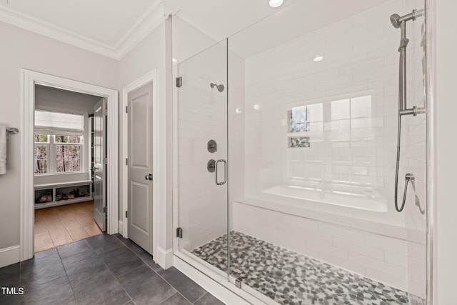 2105 Gardenbrook Dr, Raleigh, NC 27606 - bathroom featuring ornamental molding, a stall shower, and tile patterned floors