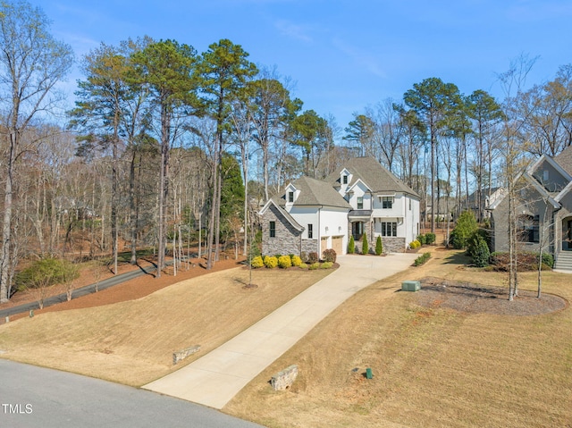 2105 Gardenbrook Dr, Raleigh, NC 27606 - view of front of house with stone siding, concrete driveway, and an attached garage