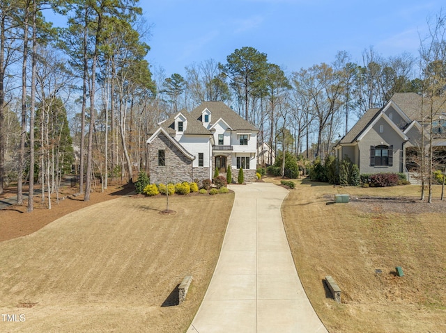 2105 Gardenbrook Dr, Raleigh, NC 27606 - view of front of house with stone siding and concrete driveway