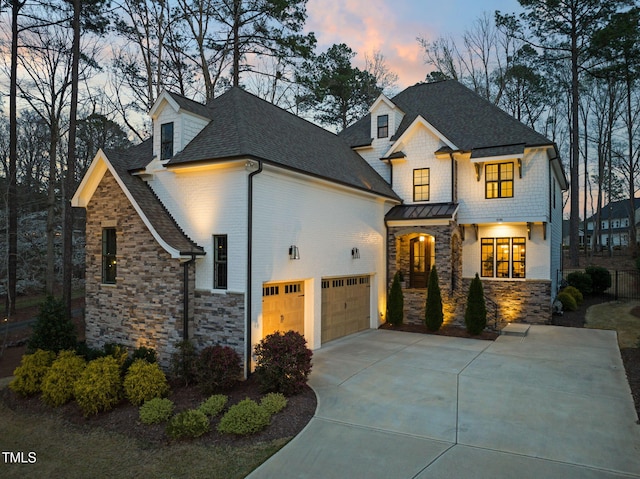 2105 Gardenbrook Dr, Raleigh, NC 27606 - view of front of home with stone siding, roof with shingles, driveway, and a garage