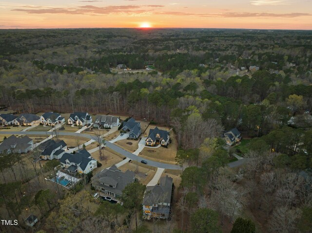2105 Gardenbrook Dr, Raleigh, NC 27606 - aerial view of property and surrounding area with a forest and nearby suburban area