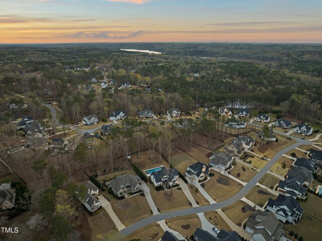 2105 Gardenbrook Dr, Raleigh, NC 27606 - aerial view at dusk of a residential view and a forest view