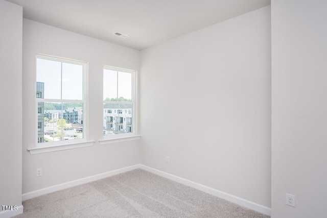 4703 Mint Leaf Ln, Raleigh, NC 27612 - carpeted spare room featuring baseboards