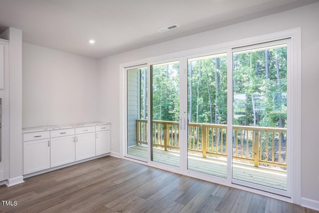 4703 Mint Leaf Ln, Raleigh, NC 27612 - spare room with wood finished floors and recessed lighting