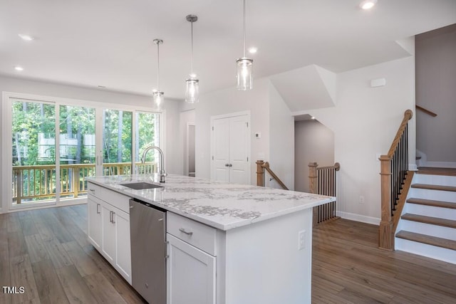 4703 Mint Leaf Ln, Raleigh, NC 27612 - kitchen featuring stainless steel dishwasher, dark wood-style flooring, white cabinets, a kitchen island with sink, and recessed lighting