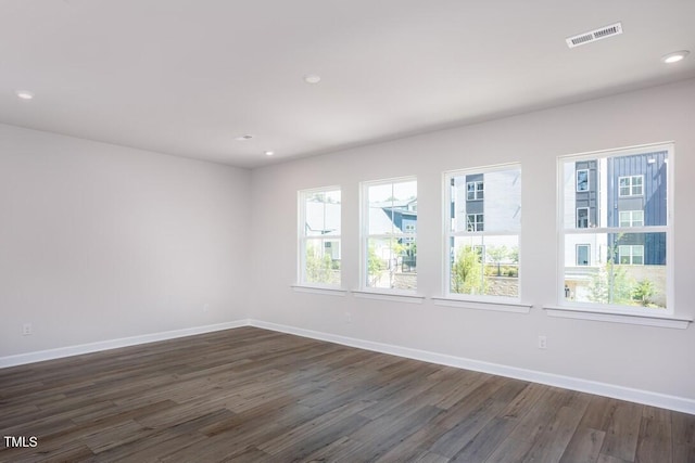 4703 Mint Leaf Ln, Raleigh, NC 27612 - unfurnished room featuring dark wood-style flooring and recessed lighting