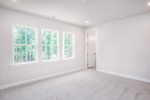 4703 Mint Leaf Ln, Raleigh, NC 27612 - spare room featuring plenty of natural light, recessed lighting, and carpet floors