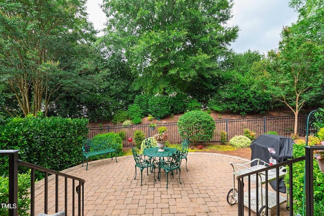 4164 English Garden Way, Raleigh, NC 27612 - fenced backyard with a patio and outdoor dining space