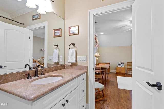 4164 English Garden Way, Raleigh, NC 27612 - bathroom with ornamental molding, vanity, and wood finished floors