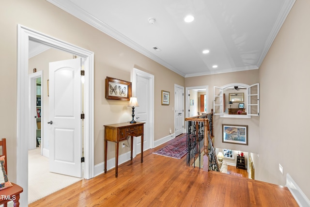 4164 English Garden Way, Raleigh, NC 27612 - hallway with an upstairs landing, wood finished floors, crown molding, and recessed lighting