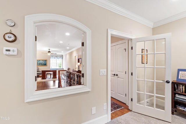 4164 English Garden Way, Raleigh, NC 27612 - hallway featuring crown molding, recessed lighting, wood finished floors, and arched walkways