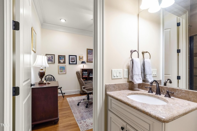 4164 English Garden Way, Raleigh, NC 27612 - bathroom featuring ornamental molding, vanity, wood finished floors, and recessed lighting