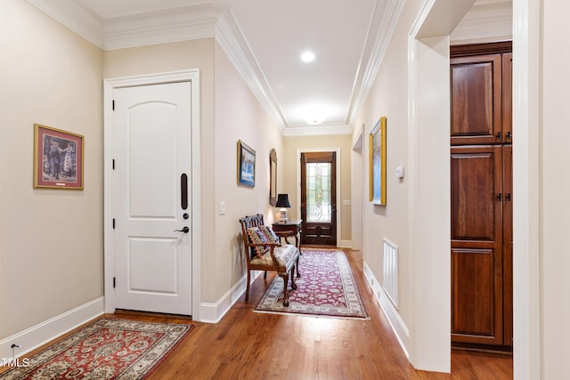 4164 English Garden Way, Raleigh, NC 27612 - foyer with light wood-style flooring and ornamental molding