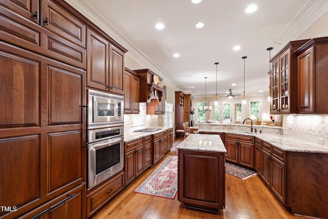 4164 English Garden Way, Raleigh, NC 27612 - kitchen featuring built in appliances, ornamental molding, a peninsula, glass insert cabinets, and recessed lighting