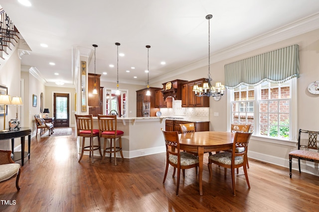 4164 English Garden Way, Raleigh, NC 27612 - dining area with healthy amount of natural light, dark wood finished floors, ornamental molding, and recessed lighting