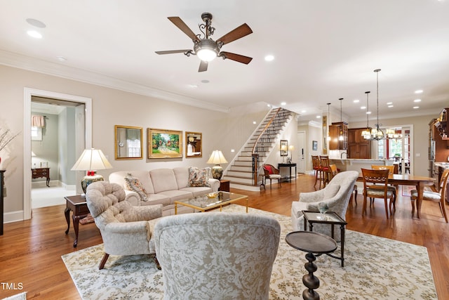 4164 English Garden Way, Raleigh, NC 27612 - living area featuring stairs, crown molding, a ceiling fan, light wood-style flooring, and recessed lighting