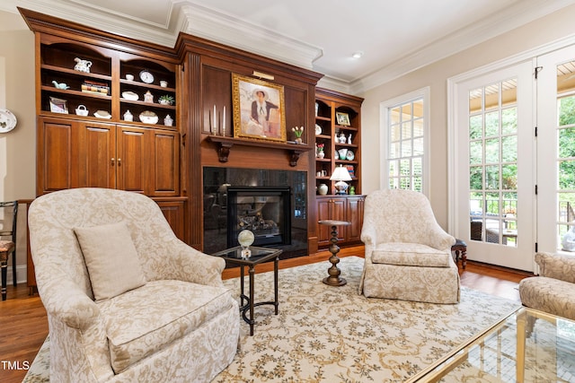 4164 English Garden Way, Raleigh, NC 27612 - living room with ornamental molding, a tile fireplace, wood finished floors, and healthy amount of natural light