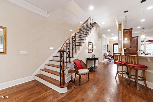 4164 English Garden Way, Raleigh, NC 27612 - staircase featuring crown molding, wood finished floors, and recessed lighting