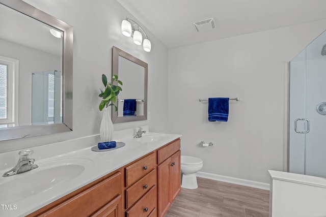 2508 Hidden Meadow Dr, Fuquay Varina, NC 27526 - full bath with double vanity, a stall shower, and wood finished floors
