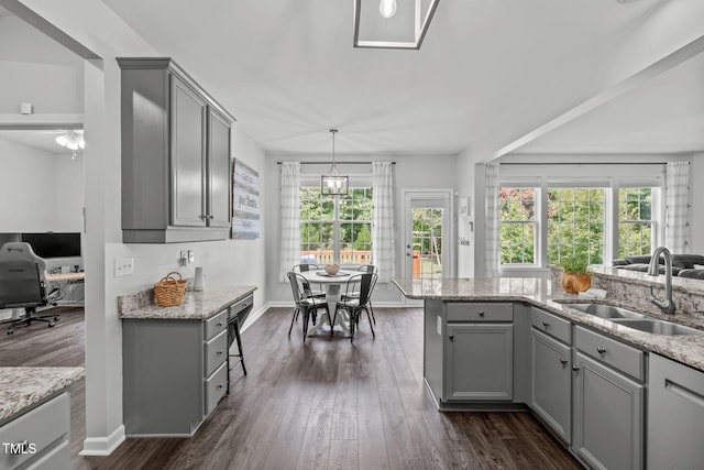 2508 Hidden Meadow Dr, Fuquay Varina, NC 27526 - kitchen with gray cabinetry, plenty of natural light, and dark wood-style floors
