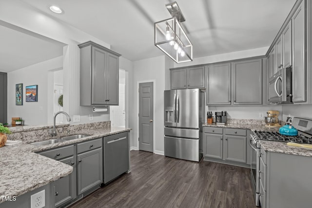 2508 Hidden Meadow Dr, Fuquay Varina, NC 27526 - kitchen featuring stainless steel appliances, gray cabinetry, light stone counters, dark wood-style floors, and recessed lighting