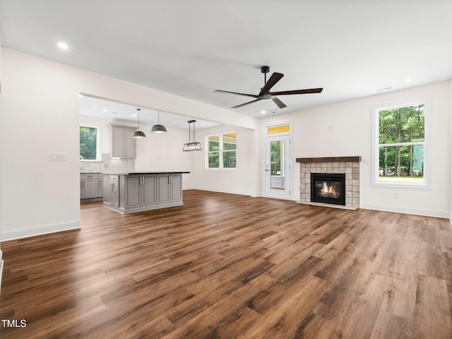 10 Hermitage, Franklinton, NC 27525 - unfurnished living room featuring ceiling fan, wood finished floors, plenty of natural light, and recessed lighting