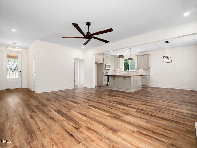10 Hermitage, Franklinton, NC 27525 - unfurnished living room featuring ceiling fan, wood finished floors, and recessed lighting