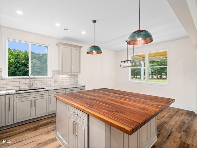 10 Hermitage, Franklinton, NC 27525 - kitchen with wood counters, decorative backsplash, light wood-type flooring, gray cabinetry, and recessed lighting