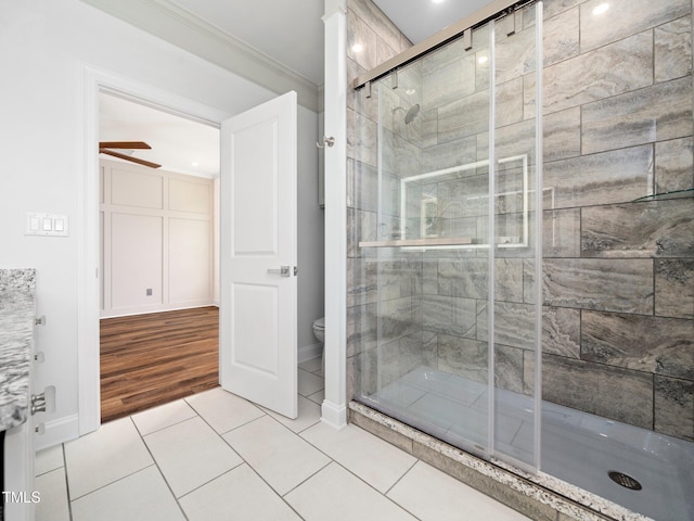 10 Hermitage, Franklinton, NC 27525 - bathroom with a stall shower, ornamental molding, tile patterned flooring, and a ceiling fan