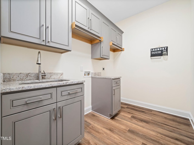 10 Hermitage, Franklinton, NC 27525 - washroom featuring washer hookup, wood finished floors, electric dryer hookup, and cabinet space