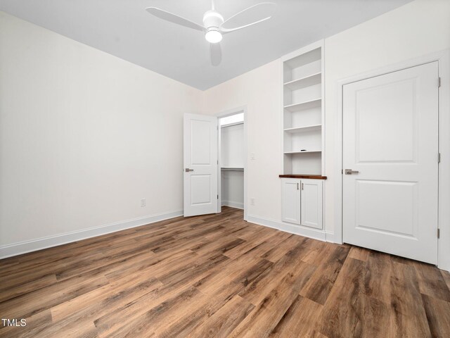 10 Hermitage, Franklinton, NC 27525 - unfurnished bedroom featuring wood finished floors, a ceiling fan, and a closet