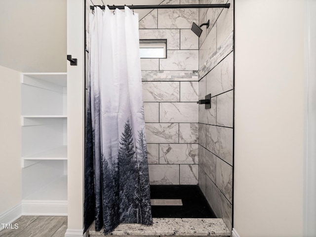 10 Hermitage, Franklinton, NC 27525 - full bathroom featuring a tile shower and wood finished floors