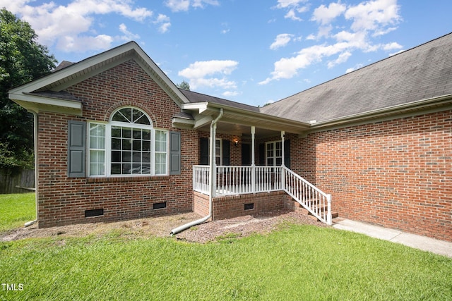 104 Fairfield Dr, Goldsboro, NC 27530 - view of front of house featuring crawl space, a porch, a front yard, and brick siding