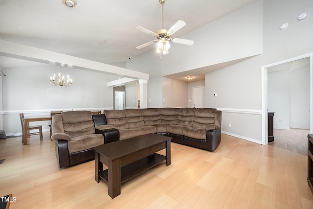 104 Fairfield Dr, Goldsboro, NC 27530 - living room featuring light wood-style flooring, ceiling fan, high vaulted ceiling, and a chandelier