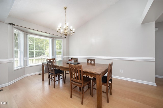 104 Fairfield Dr, Goldsboro, NC 27530 - dining room featuring a chandelier, light wood-style floors, and vaulted ceiling