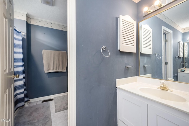 104 Fairfield Dr, Goldsboro, NC 27530 - bathroom with vanity, a textured ceiling, and tile patterned floors