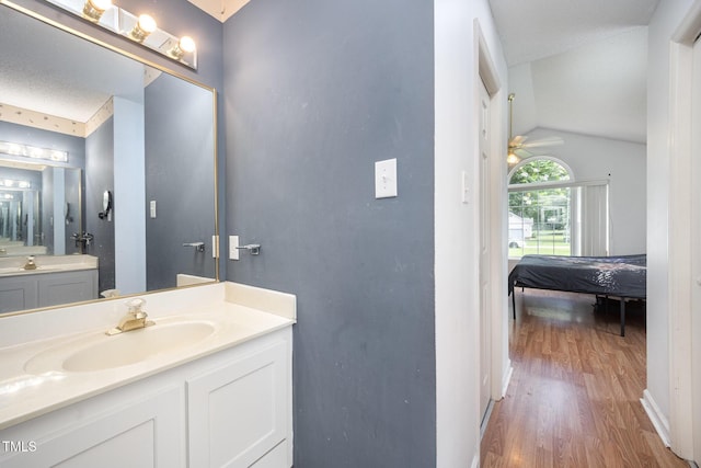 104 Fairfield Dr, Goldsboro, NC 27530 - bathroom with wood finished floors, vanity, vaulted ceiling, ceiling fan, and connected bathroom