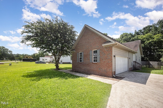 104 Fairfield Dr, Goldsboro, NC 27530 - view of side of home with brick siding, concrete driveway, and an attached garage