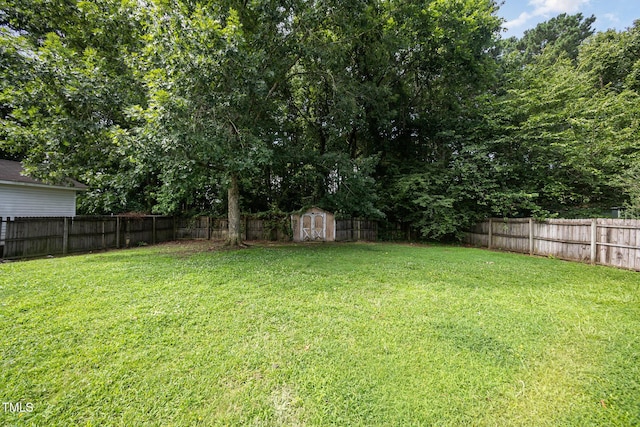 104 Fairfield Dr, Goldsboro, NC 27530 - fenced backyard with a storage unit
