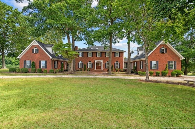 387 Three Bridge Rd, Dunn, NC 28334 - view of front facade with a front lawn and brick siding
