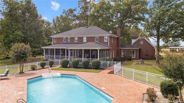 387 Three Bridge Rd, Dunn, NC 28334 - rear view of property featuring a sunroom, a fenced backyard, and a patio area