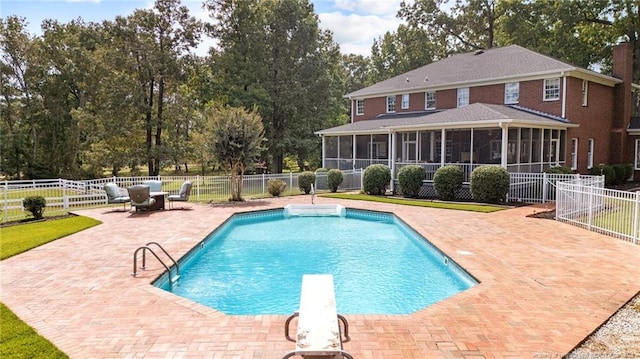 387 Three Bridge Rd, Dunn, NC 28334 - view of swimming pool with a sunroom, a patio area, a fenced backyard, and a diving board