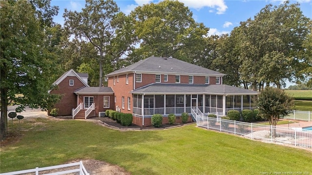 387 Three Bridge Rd, Dunn, NC 28334 - rear view of property with a sunroom