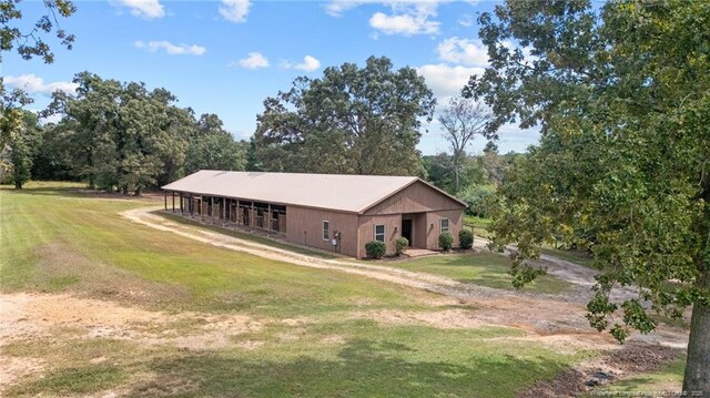 387 Three Bridge Rd, Dunn, NC 28334 - view of front of home featuring a front lawn, an outdoor structure, and a pole building