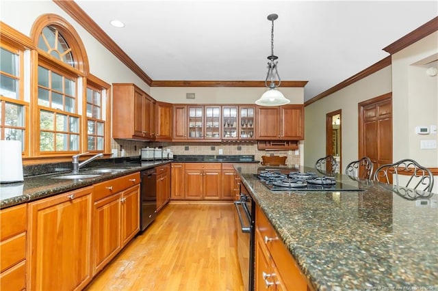 387 Three Bridge Rd, Dunn, NC 28334 - kitchen featuring black appliances, brown cabinetry, hanging light fixtures, light wood-type flooring, and ornamental molding