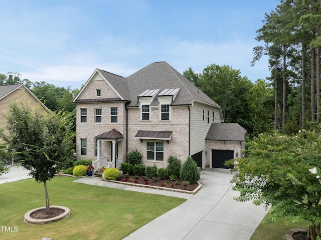 1089 Queensdale Dr, Cary, NC 27519 - view of front of home with a standing seam roof, driveway, a garage, a front yard, and brick siding