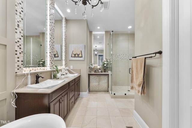 1089 Queensdale Dr, Cary, NC 27519 - full bathroom with a stall shower, double vanity, a chandelier, recessed lighting, and a soaking tub