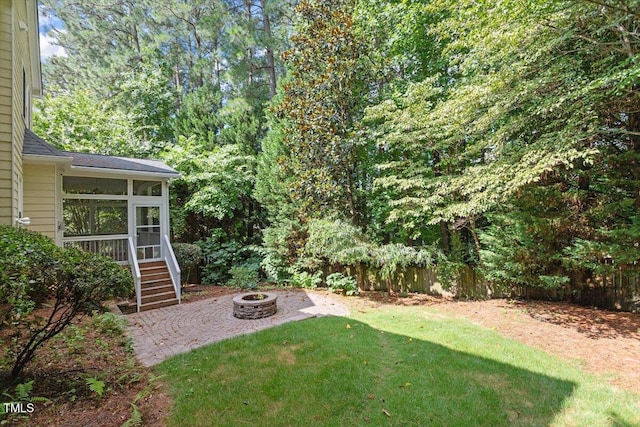 109 Gullane Ct, Apex, NC 27502 - view of yard with an outdoor fire pit, a sunroom, stairs, and a patio