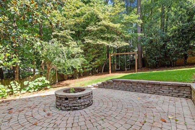 109 Gullane Ct, Apex, NC 27502 - fenced backyard featuring an outdoor fire pit and a patio area
